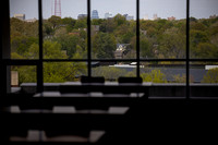 042423 MCOM Students in library studying with skyline in the background