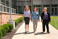 073113 NHS Ladies walking outside health sciences building